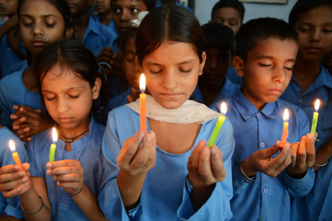 Indian school children hold candles as they pay tribute to school children who died from food poisoning in Saran district of Bihar state. Narinder Nanu /AFP/Getty Images Indian school children hold candles as they pay tribute to school children who died from food poisoning in Saran district of Bihar state. Narinder Nanu /AFP/Getty Images