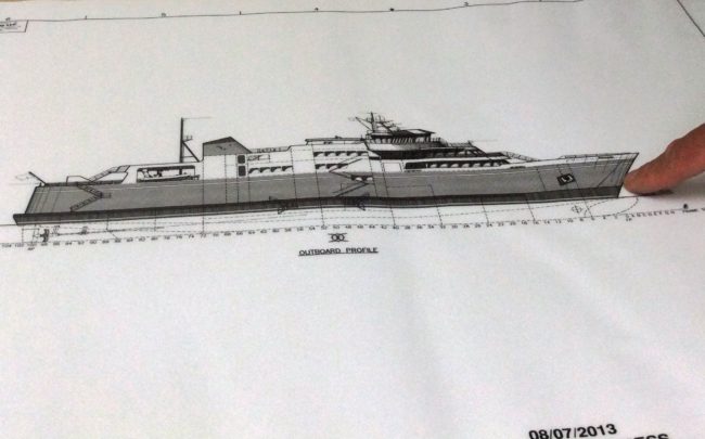 Day boat2 ACF Day Boat DOT Project Manager Doug Miller points to the bow of the proposed ferry, where vehicles would load or unload.