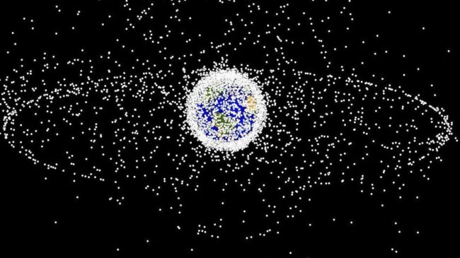 A computer image generated by NASA shows objects orbiting Earth, including those in geosynchronous orbit at a high altitude. The objects are not to scale. A computer image generated by NASA shows objects orbiting Earth, including those in geosynchronous orbit at a high altitude. The objects are not to scale.