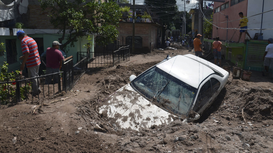 A car lays buried in mud after flooding triggered by Hurricane Manuel in Chilpancingo, Mexico. Alejandrino Gonzalez/AP A car lays buried in mud after flooding triggered by Hurricane Manuel in Chilpancingo, Mexico. Alejandrino Gonzalez/AP