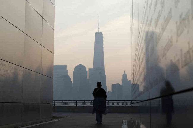 A woman looks out at One World Trade Center from inside the 9/11 Empty Sky memorial at Liberty State Park in Jersey City, N.J. on Wednesday. Americans will commemorate the 12th anniversary of the Sept. 11 attacks with solemn ceremonies and pledges to not forget the nearly 3,000 killed when hijacked jetliners crashed into the World Trade Center, the Pentagon, and a Pennsylvania field. Gary Hershorn/Reuters/Landov A woman looks out at One World Trade Center from inside the 9/11 Empty Sky memorial at Liberty State Park in Jersey City, N.J. on Wednesday. Americans will commemorate the 12th anniversary of the Sept. 11 attacks with solemn ceremonies and pledges to not forget the nearly 3,000 killed when hijacked jetliners crashed into the World Trade Center, the Pentagon, and a Pennsylvania field. Gary Hershorn/Reuters/Landov