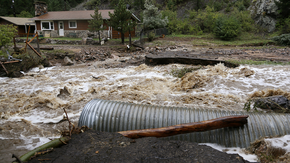 This home was stranded Thursday after a flash flood in Coal Creek destroyed a bridge near Golden, Colo. Rick Wilking /Reuters /Landov This home was stranded Thursday after a flash flood in Coal Creek destroyed a bridge near Golden, Colo. Rick Wilking /Reuters /Landov