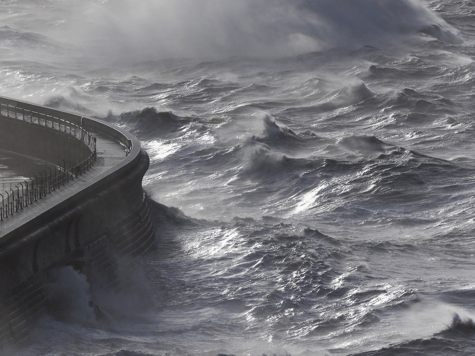 Waves produced by storm-force winds break against the harbor wall in Dover, England, on Monday. Oli Scarff/Getty Images Waves produced by storm-force winds break against the harbor wall in Dover, England, on Monday. Oli Scarff/Getty Images