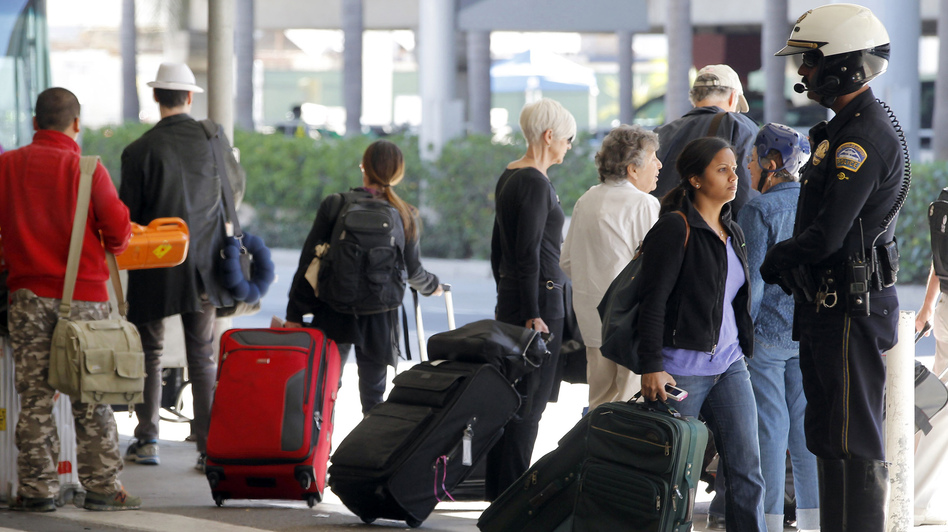 Police at Los Angeles International Airport stepped up patrols this week after two dry ice explosions. There have since been two arrests. Nick Ut/AP6.jpg Police at Los Angeles International Airport stepped up patrols this week after two dry ice explosions. There have since been two arrests. Nick Ut/AP
