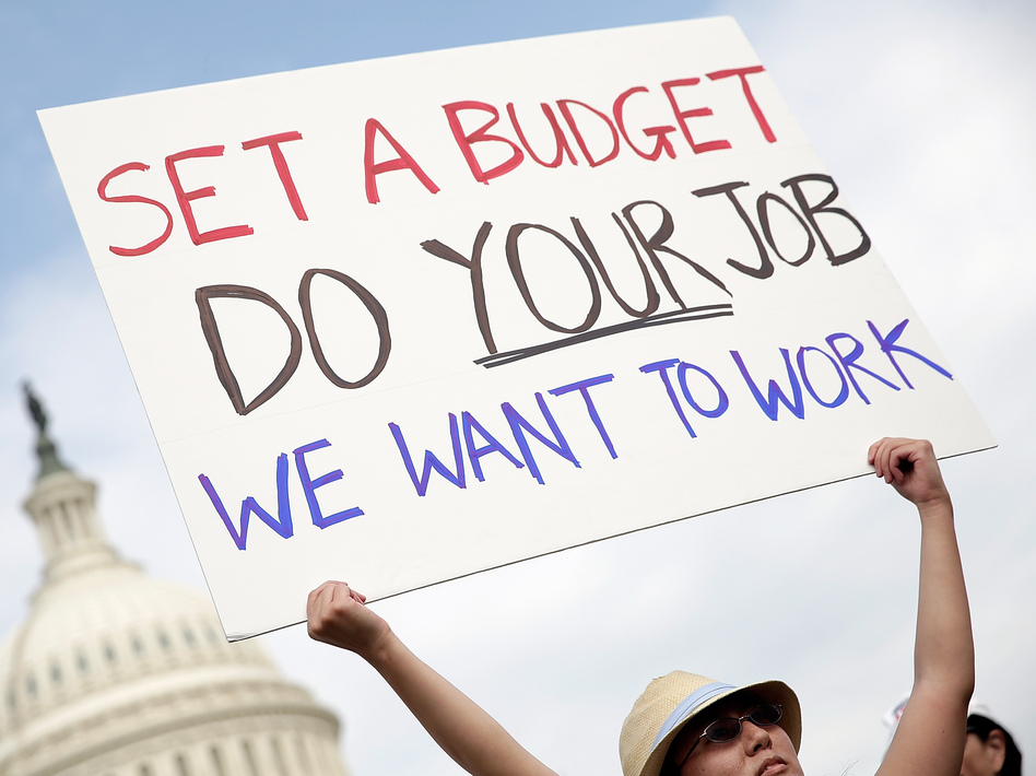 A furloughed federal worker protests outside the U.S. Capitol last week, demanding an end to the shutdown. Win McNamee/Getty Images A furloughed federal worker protests outside the U.S. Capitol last week, demanding an end to the shutdown. Win McNamee/Getty Images