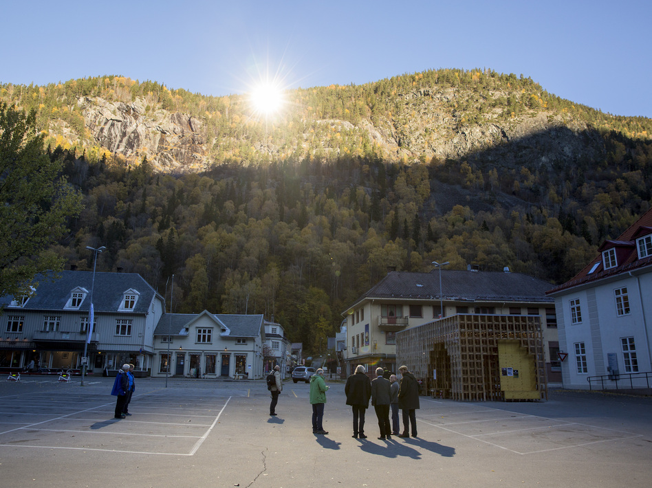 People gathered on a spot in front of the town hall of Rjukan, Norway, last week, where mirrors have focused sunlight. AFP/Getty Images People gathered on a spot in front of the town hall of Rjukan, Norway, last week, where mirrors have focused sunlight. AFP/Getty Images