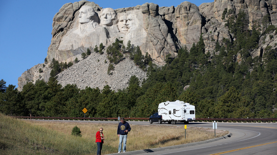 Tourists stop on the roadside near Mount Rushmore, after their visit was canceled due to the government shutdown. South Dakota and other states have reached an agreement to fund operations to reopen the parks. Scott Olson/Getty Images Tourists stop on the roadside near Mount Rushmore, after their visit was canceled due to the government shutdown. South Dakota and other states have reached an agreement to fund operations to reopen the parks. Scott Olson/Getty Images