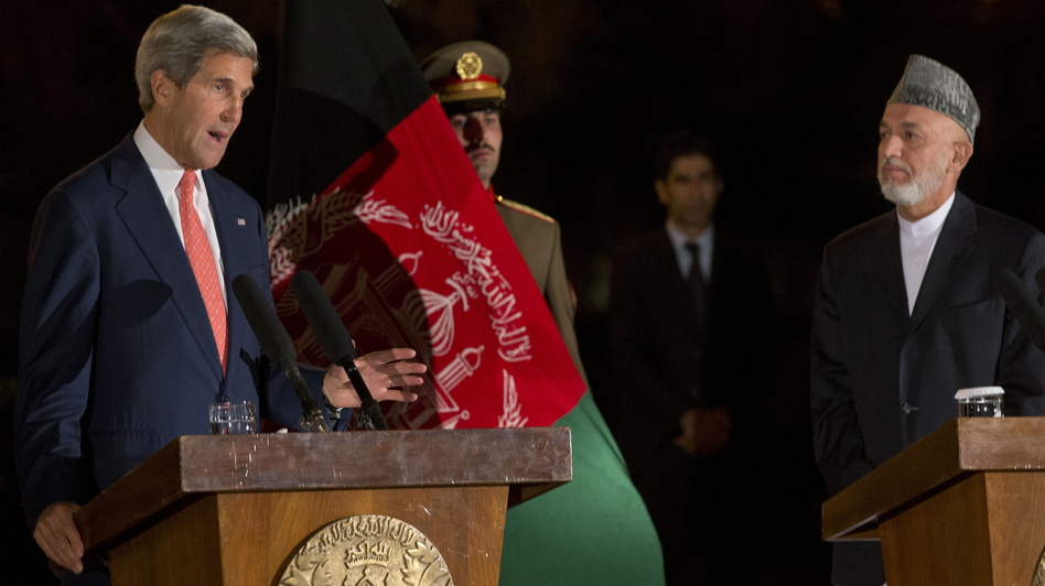 Secretary of State John Kerry describes a new partial bilateral security agreement with Afghanistan, in a news conference held Saturday after hours of discussions with Afghan President Hamid Karzai, right. AFP/AFP/Getty Images Secretary of State John Kerry describes a new partial bilateral security agreement with Afghanistan, in a news conference held Saturday after hours of discussions with Afghan President Hamid Karzai, right. AFP/AFP/Getty Images