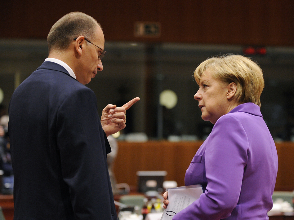 German Chancellor Angela Merkel (right) talks with Italian Prime Minister Enrico Letta on the second day of an European Council meeting in Brussels on Friday. John Thys/AFP/Getty Images German Chancellor Angela Merkel (right) talks with Italian Prime Minister Enrico Letta on the second day of an European Council meeting in Brussels on Friday. John Thys/AFP/Getty Images