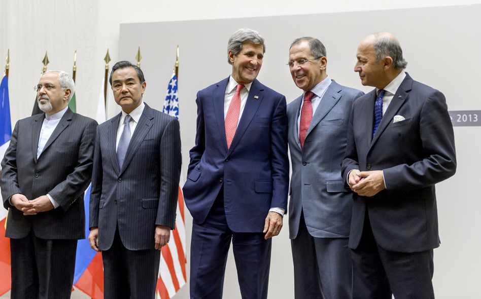 Iranian Foreign Minister Mohammad Javad Zarif, Chinese Foreign Minister Wang Yi, U.S. Secretary of State John Kerry, Russian Foreign Minister Sergei Lavrov and French Foreign Minister Laurent Fabius react during a statement early Sunday in Geneva. Fabrice Coffrini /AFP/Getty Images Iranian Foreign Minister Mohammad Javad Zarif, Chinese Foreign Minister Wang Yi, U.S. Secretary of State John Kerry, Russian Foreign Minister Sergei Lavrov and French Foreign Minister Laurent Fabius react during a statement early Sunday in Geneva. Fabrice Coffrini /AFP/Getty Images