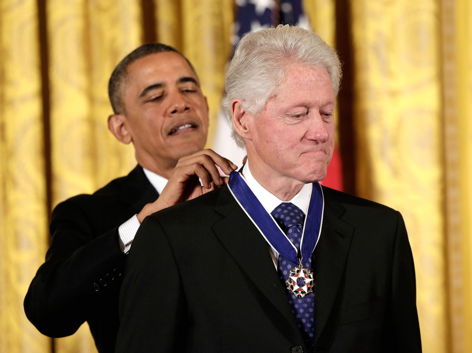 From one president to another: Former President Bill Clinton receives the Presidential Medal of Freedom from current President Obama. Win McNamee/Getty Images From one president to another: Former President Bill Clinton receives the Presidential Medal of Freedom from current President Obama. Win McNamee/Getty Images