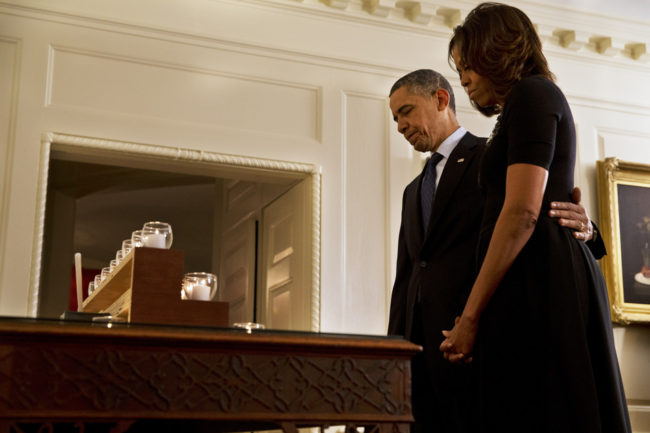 President Obama and first lady Michelle Obama take a moment of silence in honor of the Newtown shooting victims on the one year anniversary of the tragedy. Jacquelyn Martin/AP President Obama and first lady Michelle Obama take a moment of silence in honor of the Newtown shooting victims on the one year anniversary of the tragedy. Jacquelyn Martin/AP
