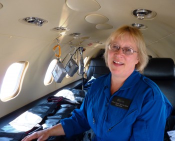 Airlift Northwest's Shelly Deering explains the medical equipment in a medevac Learjet. (Ed Schoenfeld/CoastAlaska)