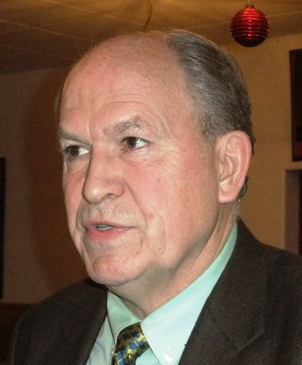 Bill Walker speaks to a reporter after his speech to the Juneau Chamber of Commerce on Thursday. (Photo by Rosemarie Alexander/KTOO)