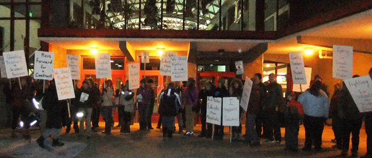 Teachers greeted Juneau school board members Tuesday as they entered JDHS for their monthly meeting. Contract negotiations are at a standstill.