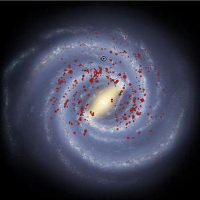 An image showing the distribution of massive stars in the new study. Our location within the Galaxy is circled in black. J. Urquhart et al./Background image by Robert Hurt of the Spitzer Science Center.