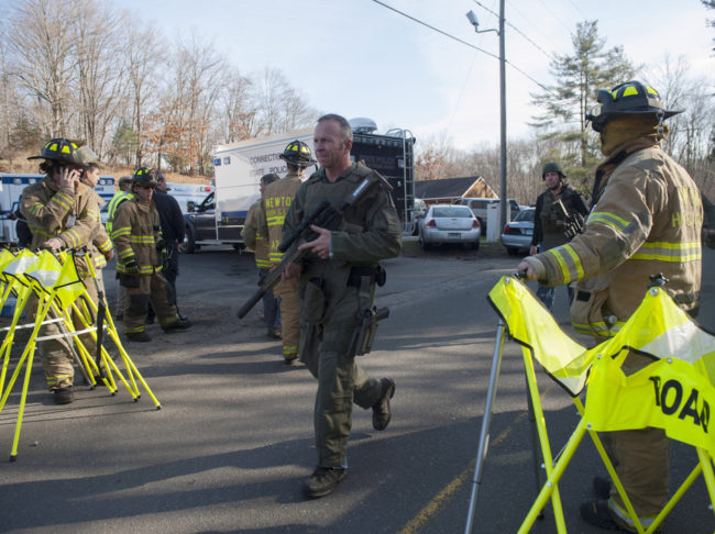 Connecticut State Police walk near the scene of the Sandy Hook Elementary School shooting on Dec. 14, 2012, in Newtown. Douglas Healey/Getty Images Connecticut State Police walk near the scene of the Sandy Hook Elementary School shooting on Dec. 14, 2012, in Newtown. Douglas Healey/Getty Images