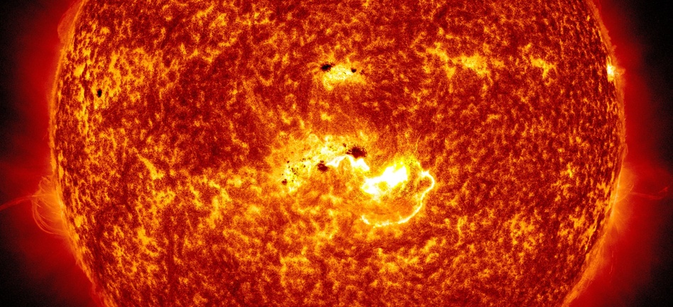 Coming At You: An image created by NASA combines two pictures from its Solar Dynamics Observatory. One shows the location of a large sunspot; the other shows Tuesday's massive solar flare. NASA/SDO