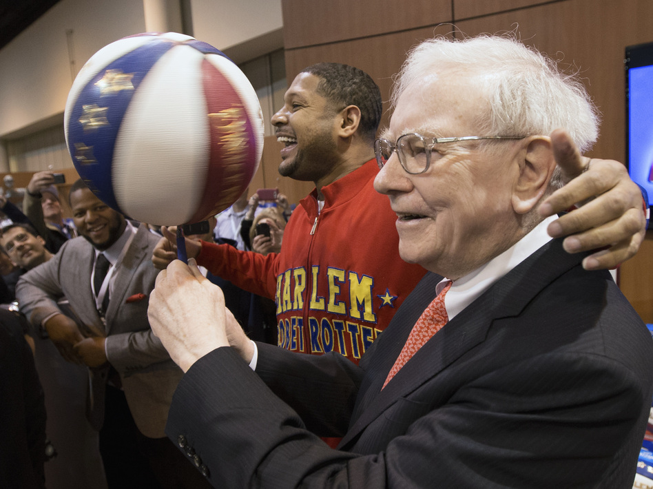 Warren Buffett with Harlem Globetrotter Chris "Handles" Franklin at Berkshire Hathaway's annual meeting in May 2013. Nati Harnik/AP