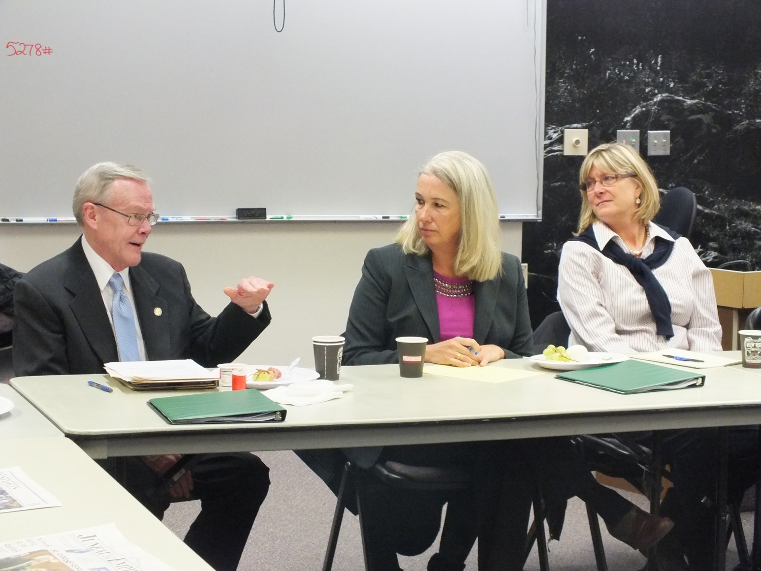 Juneau's legislative delegation, Sen. Dennis Egan, Rep. Cathy Munoz, and Rep. Beth Kerttula discuss the 2014 legislative session with the Juneau Assembly. Photo by Casey Kelly/KTOO.