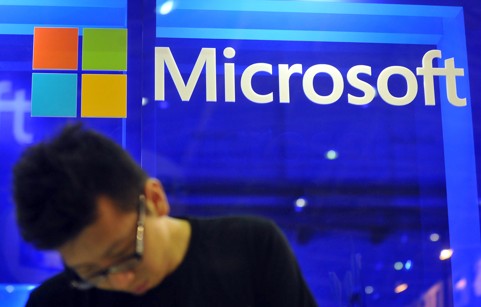 An employee stands at the Microsoft booth during the 2013 Computex in Taipei on June 4, 2013. Mandy Cheng/AFP/Getty Images