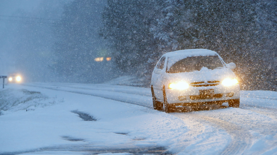 This car was navigating a snowy road early Tuesday in Fort Payne, Ala. The wicked winter weather there is spreading across the Deep South. Hal Yeager/AP
