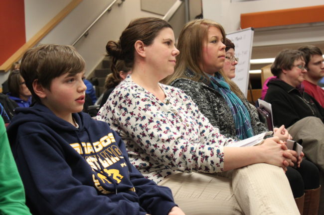 Dzantik'i Heeni Middle School student Connor Norman, his mother Michelle Norman, and school budget committee member Jennifer Lindley all testified during Tuesday night's school board meeting urging the board to reconsider the ban on middle school sports travel. (Photo by Lisa Phu/KTOO)