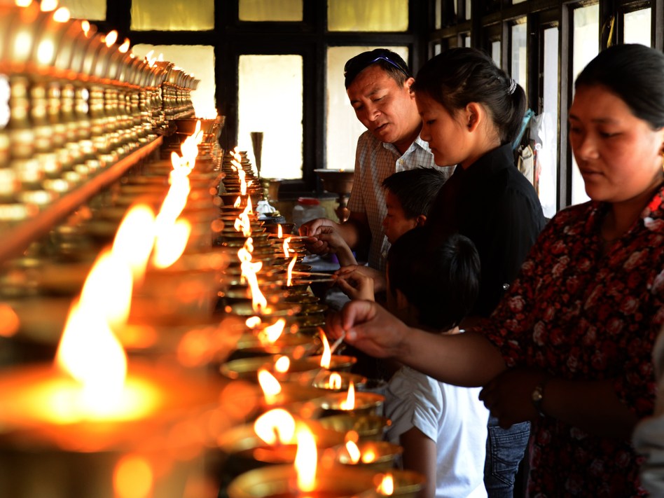 Family members of the Mount Everest avalanche victims were lighting oil lamps Sunday at a Sherpa Monastery in Kathmandu, Nepal. Prakash Mathema /AFP/Getty Images