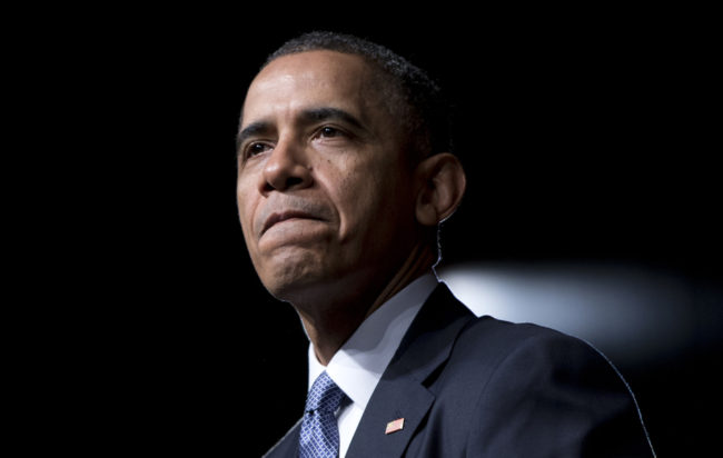President Obama pauses while speaking at the LBJ Presidential Library, on Thursday in Austin, Texas. Carolyn Kaster/AP