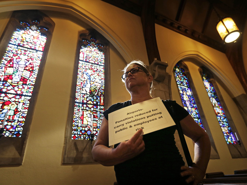 Andrea Teichner protests Georgia's new gun law at a rally at Atlanta's Central Presbyterian Church, on Wednesday. (David Goldman/AP)