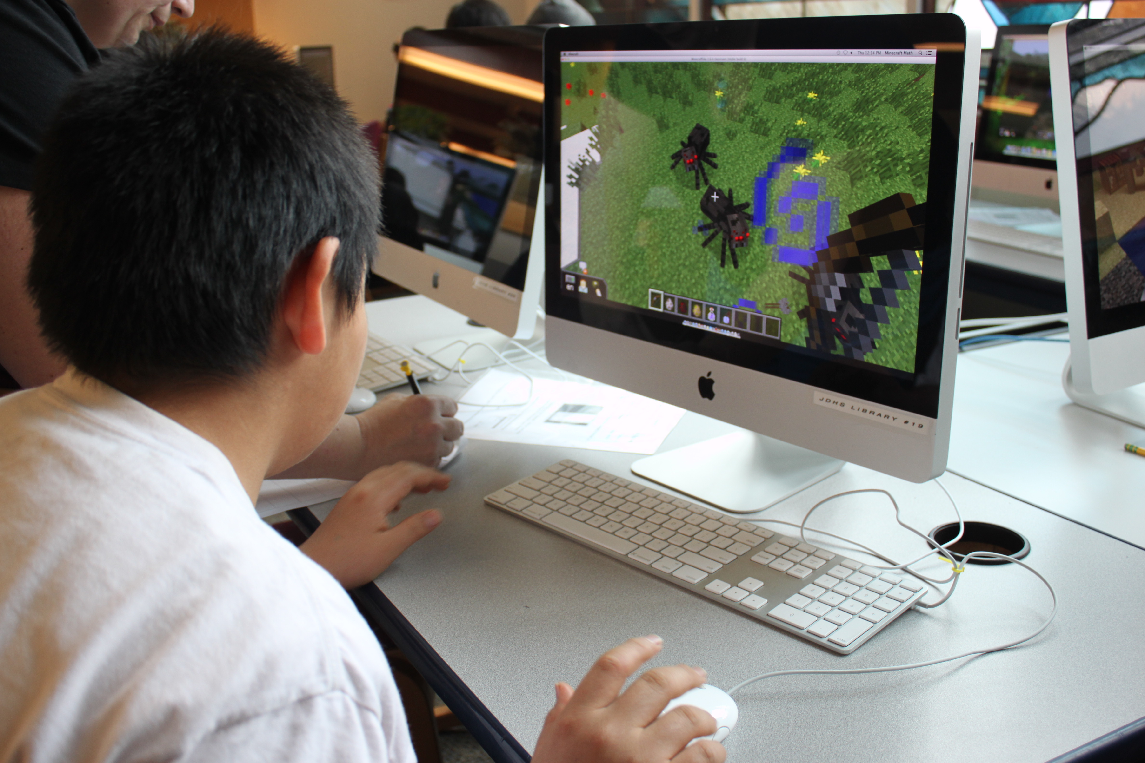For the last few minutes of class, Lexie Razor allows the class to play Minecraft in creative mode. (Photo by Lisa Phu/KTOO)