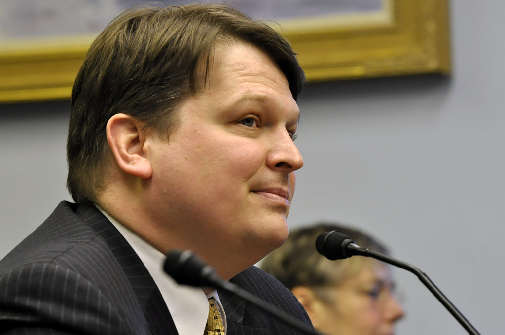 Joe Balash listens as members of the Senate Resources Committee discuss his qualifications during his confirmation hearing, Feb. 28, 2014. (Photo by Skip Gray/Gavel Alaska)