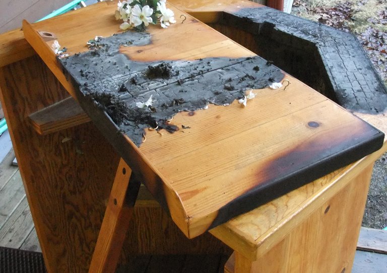 remains of the charred pulpit from Tuesday's suspicious fire at Chapel by the Lake. (Photo by Rosemarie Alexander/KTOO)
