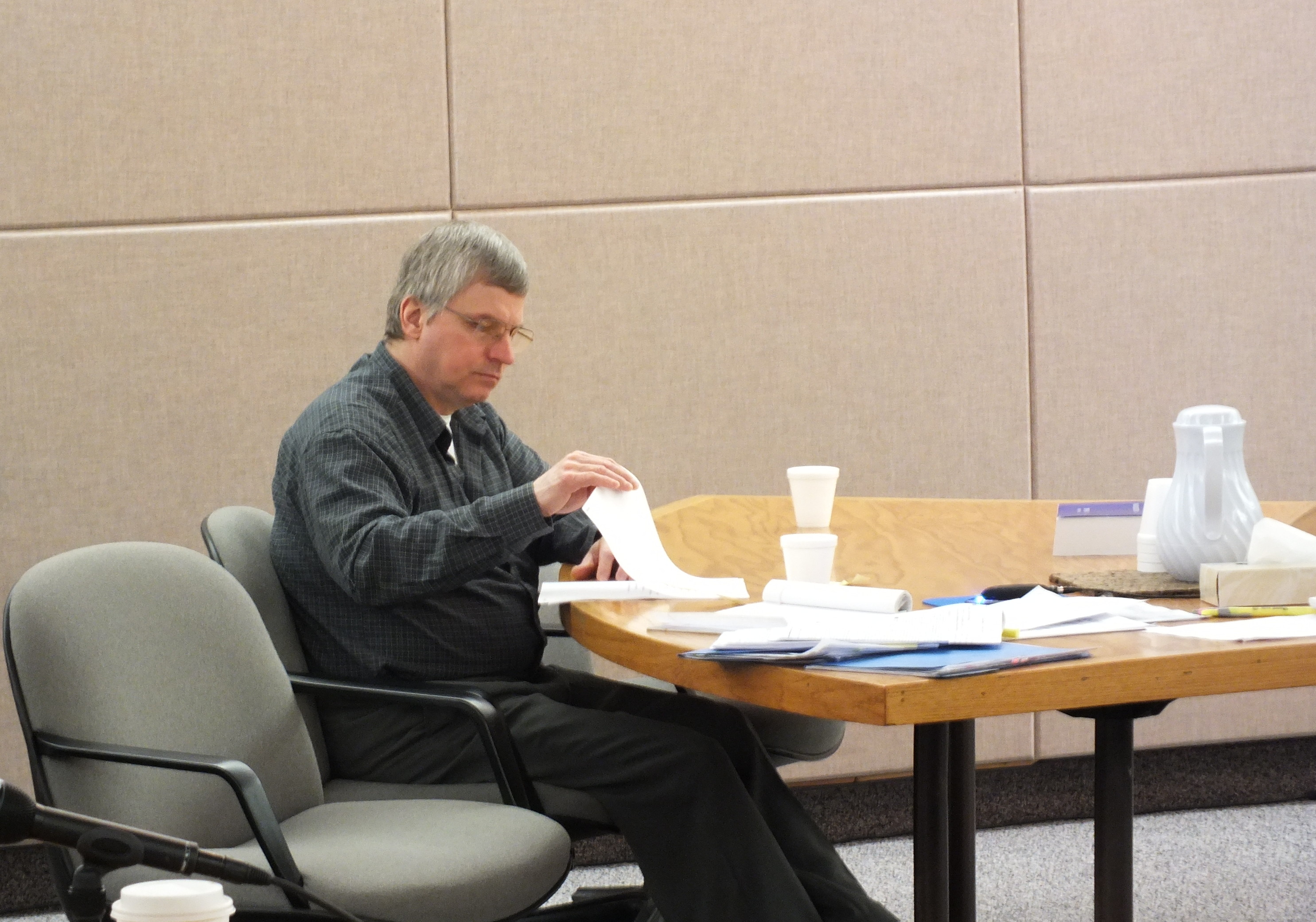 Defendant Robert Kowalski reviews some documents during his trial on Tuesday. (Photo by Matt Miller/KTOO)