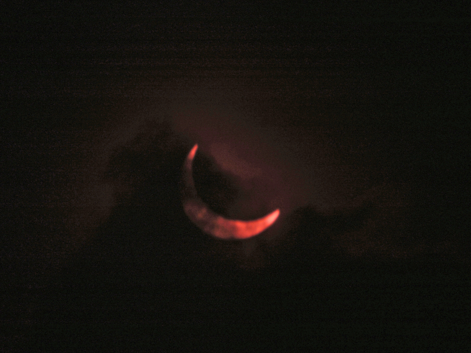 A cloud layer partially obstructs a view of a the moon passing in front of the sun in this partial solar eclipse, on Nov. 3, 2013 in Nairobi, Kenya. Sayyid Azim/AP
