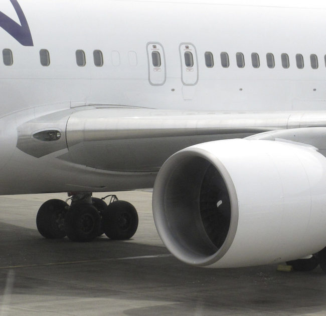 Hawaiian Airlines Flight 45 after its arrival on Monday at Maui's Kahului Airport. After the same flight landed on Sunday, a California teen emerged from the left rear wheel well. Oskar Garcia/AP
