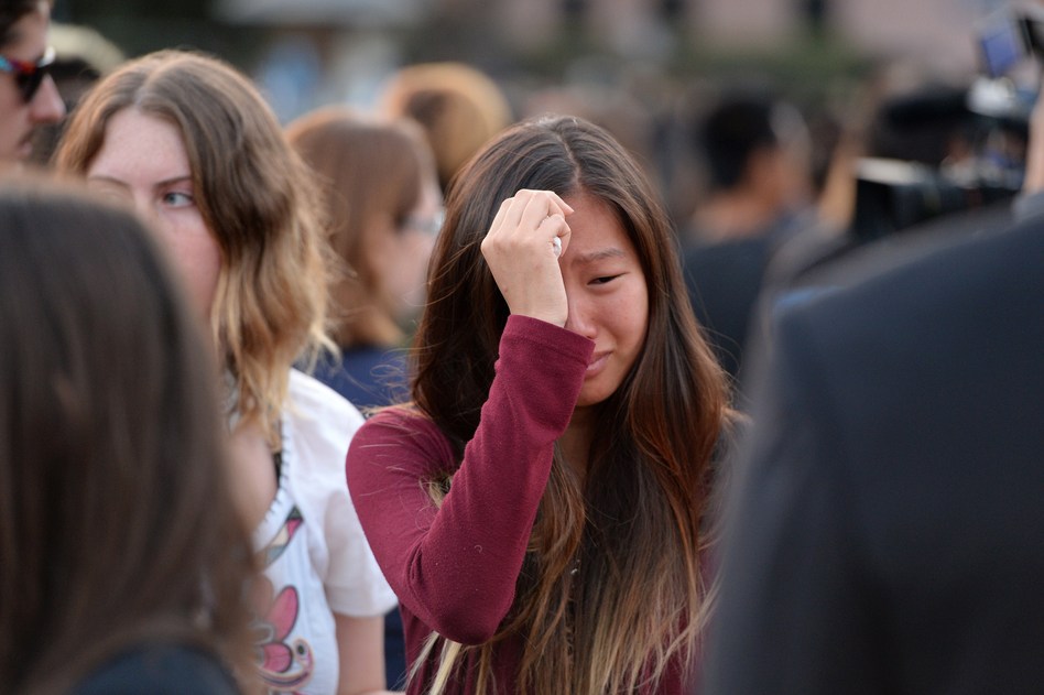 A student weeps during a candlelight vigil on Sunday for the victims of a killing spree in Isla Vista, on the University of California, Santa Barbara campus. Robyn Beck /AFP/Getty Images