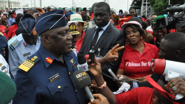 Nigeria's chief of defense staff Air Marshal Alex S. Badeh speaks during a demonstration in Abuja calling for the rescue of girls kidnapped from their school in Chibok. Badeh says the government knows where the girls are — but that a rescue attempt would endanger their lives. Gbenga Olamikan/AP