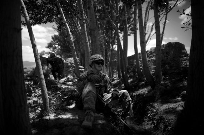Sgt. Kyle Gonzales, a sniper with the 82nd Airborne, has a cigarette after a gun battle near the village of Babaker, Giro district, Ghazni province. The soldiers have engaged in gun battles every time they push into the hamlets north of their forward operating base. David Gilkey/NPR