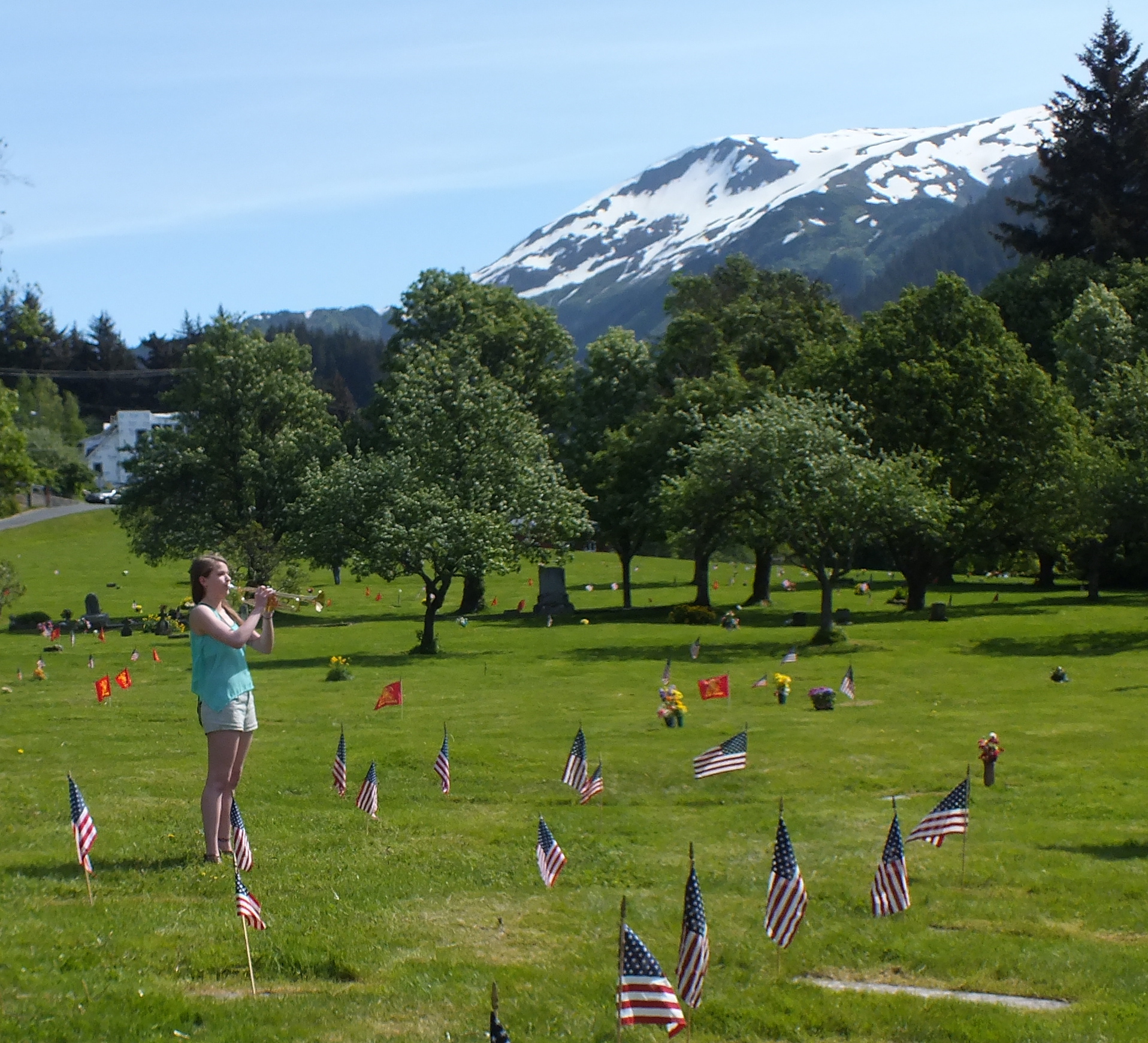 Memorial Day observances at Evergreen Cemetery featured the playing of Taps. (Photo by Matt Miller/KTOO)