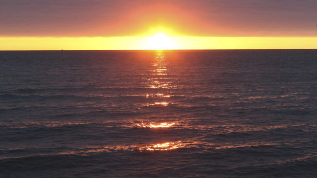 The Department of the Interior is proposing a large expansion of U.S. efforts to make energy from offshore winds, with a plan centered off the Massachusetts coast. Here, a 2010 photo shows a sunrise over Nantucket Sound. Julia Cumes/AP