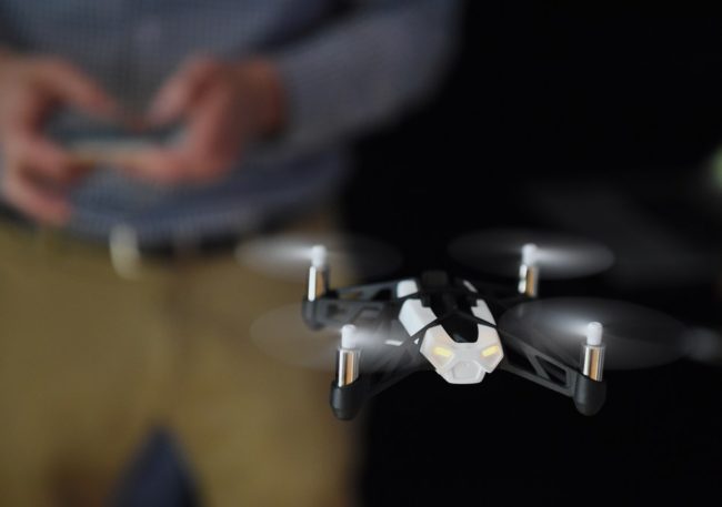 Technology journalist Tim Stenovec controls a Parrot Minidrone "Rolling Spider" during a demonstration in June in New York. Stan Honda /AFP/Getty Images