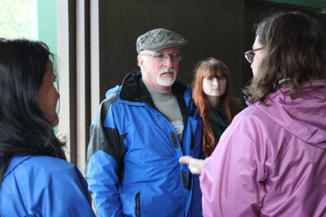 Incoming Juneau superintendent Mark Miller spoke with board members, teachers and members of the public during Sunday's community meet and greet of superintendent candidates. (Photo by Lisa Phu/KTOO)
