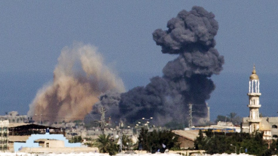 A picture taken from the Israeli border with the Gaza Strip shows smoke billowing from the coastal Palestinian enclave following an Israeli airstrike Wednesday. Jack Guez/AFP/Getty Images