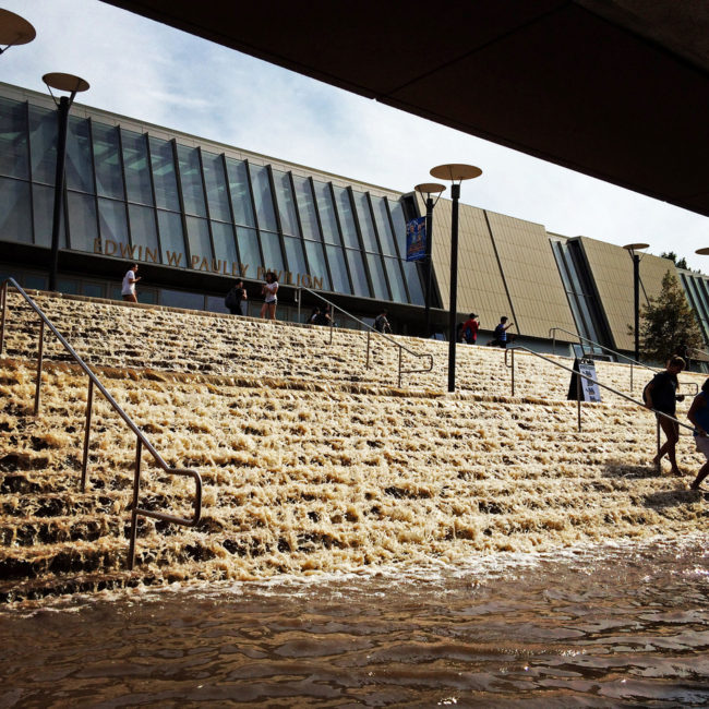 Water cascades down a stairway to a parking structure adjacent to Pauley Pavlion, home of UCLA basketball. Paul Phootrakul/AP