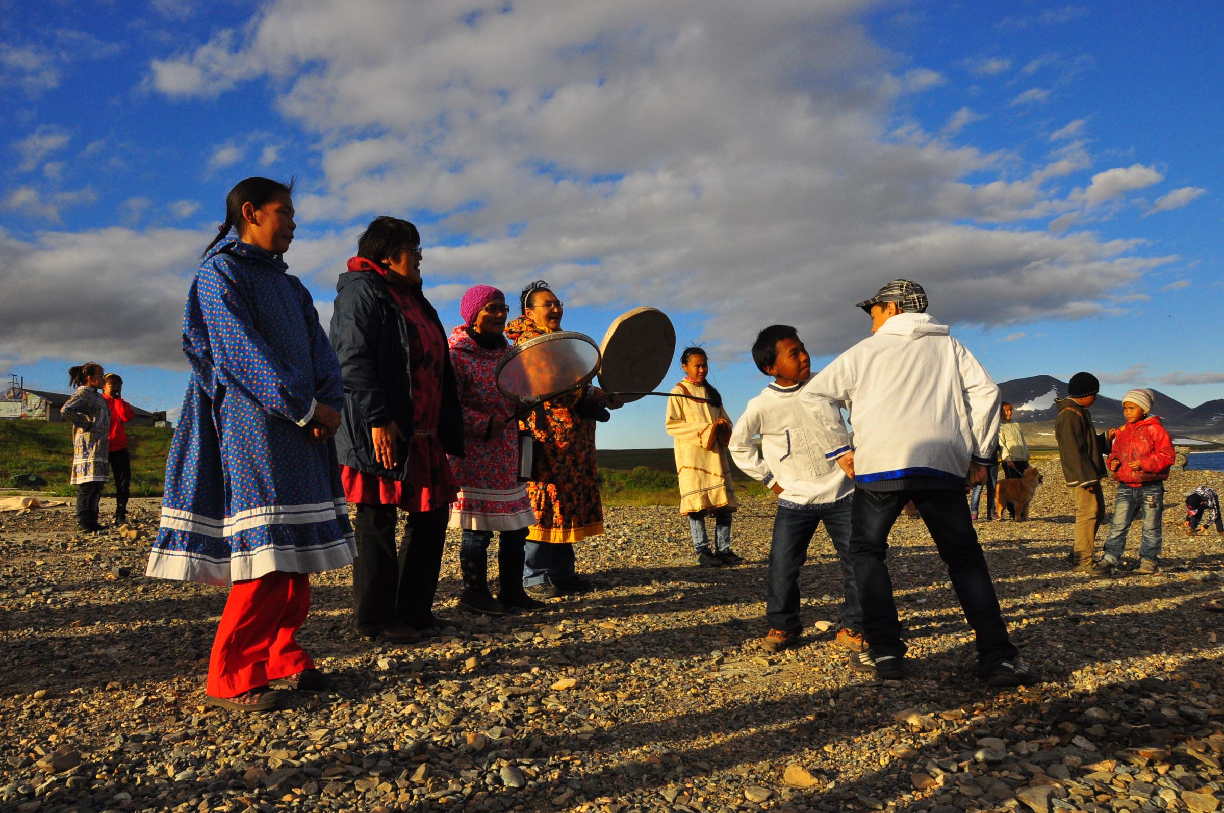 The residents of Novoye Chaplino greeted vistors when they arrived on the beach with traditional song and dance. (Photo by Emily Schwing/KUAC)