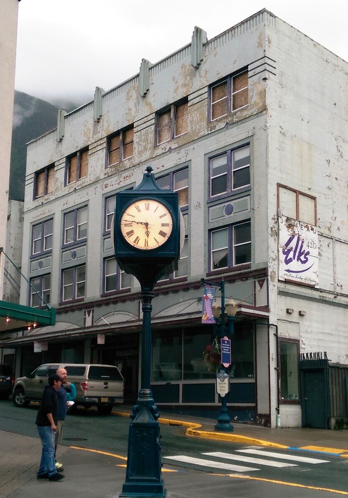 The burned out Gastineau Apartments frame Juneau's historical Front Street clock. (Photo by Rosemarie Alexander/KTOO)
