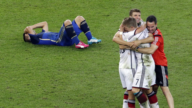 Germany's players celebrate after winning 1-0 on extra time at the World Cup final soccer match between Germany and Argentina at the Maracana Stadium in Rio de Janeiro, Brazil on Sunday. Hassan Ammar/AP