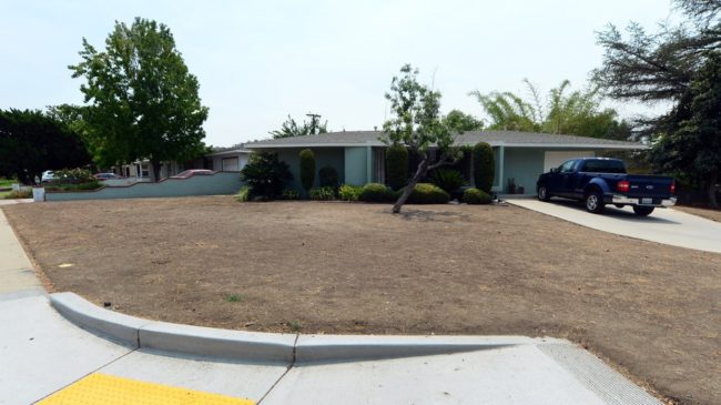 A dried-out lawn is seen in the city of Glendora, east of Los Angeles, this week. About 58 percent of California is now under the most extreme drought conditions, a new report says. Frederic J. Brown/AFP/Getty Images