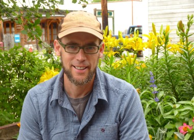 Gitanyow Fisheries Authority Fish and Wildlife Biologist Kevin Koch talks about mine impacts in a small park in Old Hazelton, B.C. (Ed Schoenfeld, CoastAlaska News)